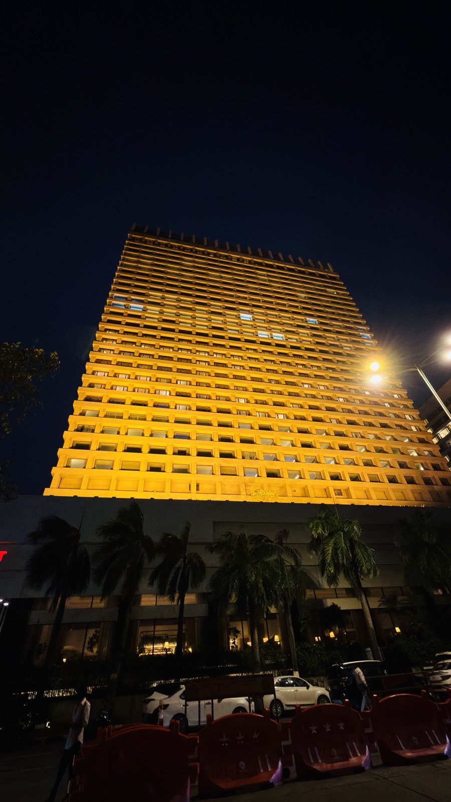 Trident Nariman Point Mumbai exterior at night, overlooking Marine Drive